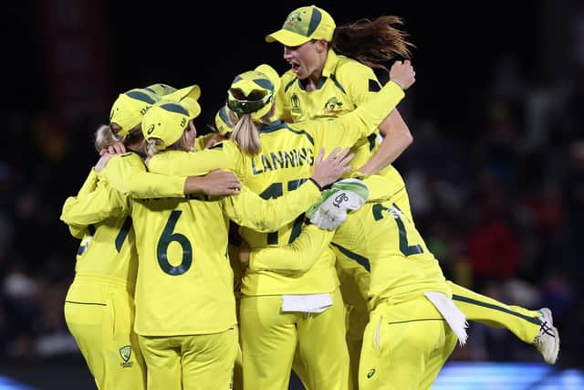 Australian players celebrate defeating England in the final of the ICC Women's Cricket World Cup match in Christchurch, New Zealand (Martin Hunter/Photosport via AP)
