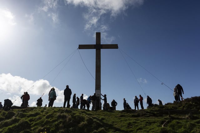 Volunteers help put the 30ft cross at the top of Otley Chevin hill each year.