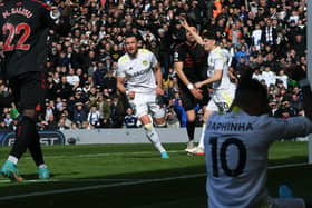 Leeds United's Jack Harrison celebrates scoring as Raphinha looks on having whipped the ball in from the byline (Picture: Jonathan Gawthorpe)