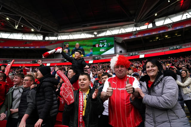 Rotherham fans celebrate at Wembley after watching their side beating Sutton.