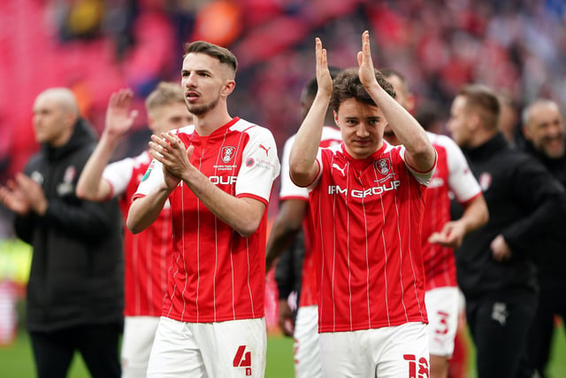 Rotherham United's Daniel Barlaser and Oliver Rathbone applauds the fans