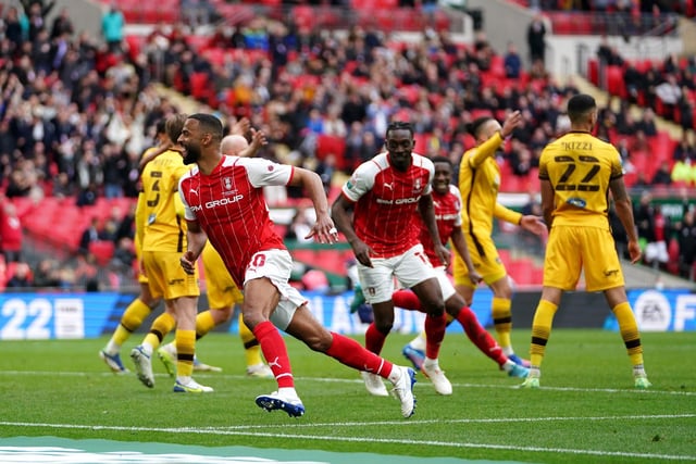Rotherham United's Michael Ihiekwe, second left, celebrates scoring their side's fourth goal of the game in the second half of extra time.