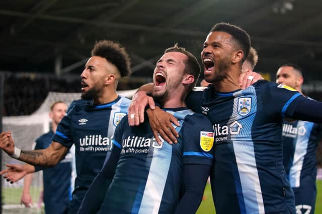KEY MOMENT: Harry Toffolo scored the only goal of the game as Huddersfield beat Hull. Picture: PA Wire.