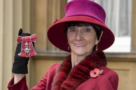 June Brown stands outside Buckingham Palace in London in November 2008 after receiving an MBE for services to Drama and Charity from Queen Elizabeth II