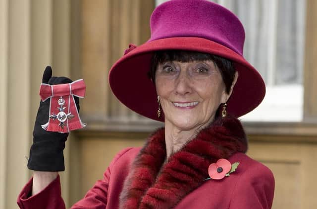 June Brown stands outside Buckingham Palace in London in November 2008 after receiving an MBE for services to Drama and Charity from Queen Elizabeth II