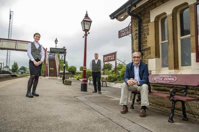 Staycation Express director Adrian Quine with staff at Settle Station