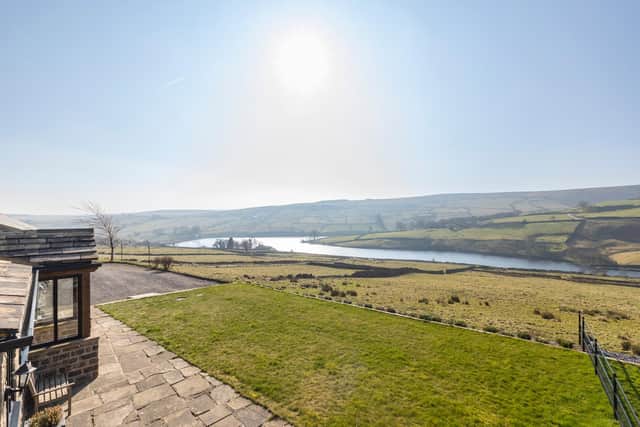 Owd Ikes Farm with spectacular views across Ponden reservoir to the moors beyond
