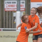 Ellie White celebrates with Brighouse Town top scorer Leah Embley. Pic: Ray Spencer.