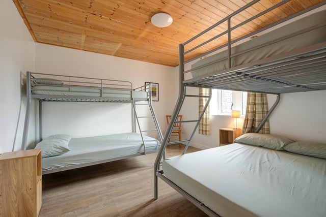 This room has both double and single bunk beds, which are perfect for families