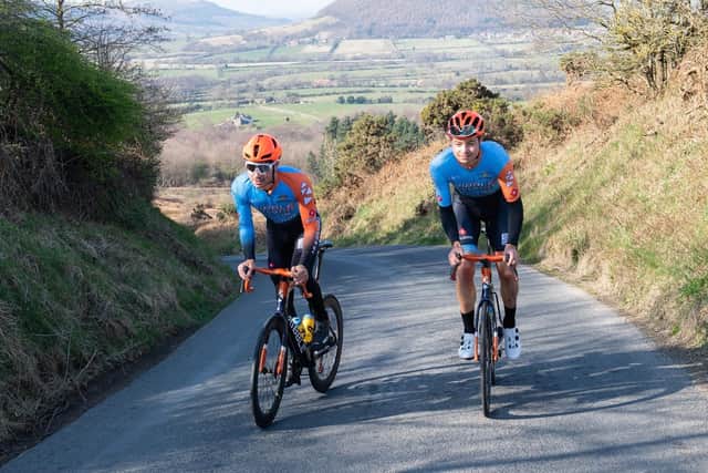 Charlie and Harry Tanfield riding up Carlton Bank
