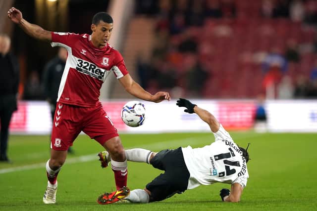 Fulham's Bobby Decordova-Reid (right) tackles Middlesbrough's Lee Peltier during the Sky Bet Championship match at the Riverside Stadium, Middlesbrough. (Picture: PA)