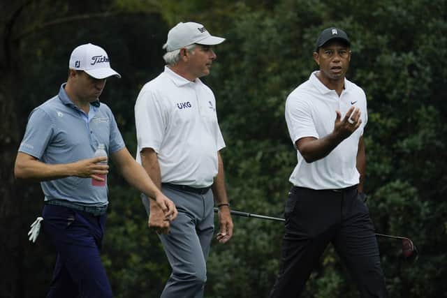 TIGER TALK: Tiger Woods, right, walks with Fred Couples and Justin Thomas on the 11th fairway during a practice round for Thursday's US Masters. Picture: AP Photo/Robert F. Bukaty.