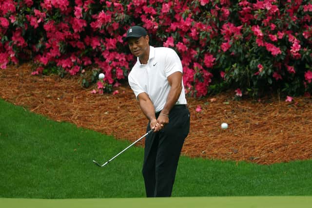 ON COURSE: Tiger Woods plays a shot during his practice round ahead of Thursday's US Masters at Augusta. Picture: Andrew Redington/Getty Images.