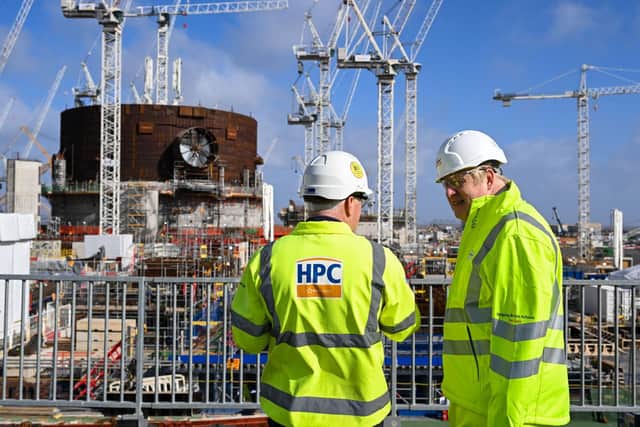 Prime Minister Boris Johnson, with Stuart Crooks Managing Director Hinkley Point C, during a visit to Hinkley Point C nuclear power station construction site in Somerset.