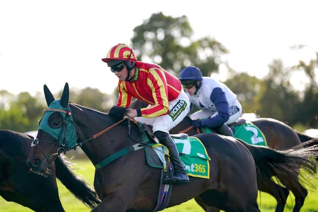 Top Ville Ben ridden by jockey Tommy Dowson (centre) in action during the bet365 Charlie Hall Chase at Wetherby racecourse. (Picture: Tim Goode/PA Wire)