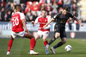 Charlton Athletic's Conor Washington (right) battles for the ball with Rotherham United's Michael Ihiekwe (left) and Ben Wiles at the AESSEAL New York Stadium. Picture: Richard Sellers/PA