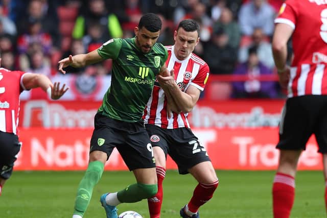 Bournemouth's Dominic Solanke (left) was frustrated by the Sheffield United defence - including  Filip Uremovic - at Bramall Lane on Saturday. Picture: Simon Bellis/Sportimage