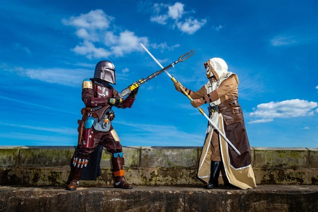 Wilson Whitley, dressed as Mandalorian, and his wife Tammy, dressed as a Jedi Guard, members of Mos Eisley Misfits, protect the Scarborough Spa walls for oncoming enemy.