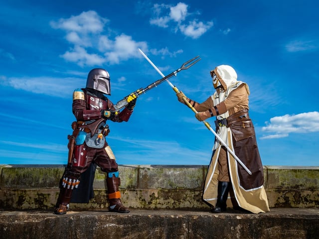 Wilson Whitley, dressed as Mandalorian, and his wife Tammy, dressed as a Jedi Guard, members of Mos Eisley Misfits, protect the Scarborough Spa walls for oncoming enemy.