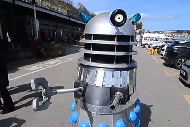 A Dalek terrifies passers by on Scarborough seafront