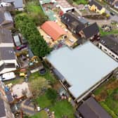 New aerial photos above Graham Wildin's home show a new building - which locals say started appearing late last year.