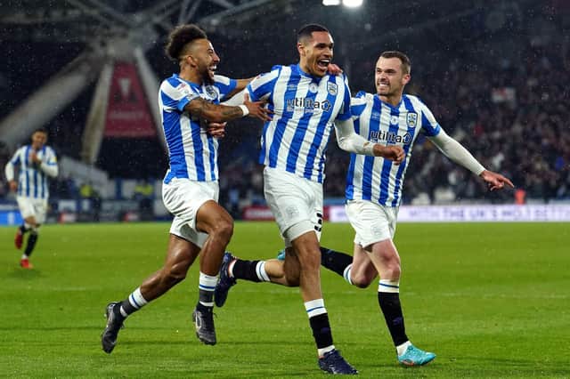 Jon Russell celebrates his opener for Huddersfield Town against Luton. Picture: PA