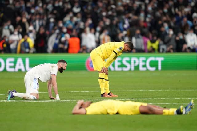CLASSIC FAYRE: Real Madrid's Karim Benzema (left) celebrates as Chelsea's Thiago Silva shows his dismay following their UEFA Champions League quarter final, second leg clash at the Bernabeu Stadium on Tuesday night. Picture: Nick Potts/PA