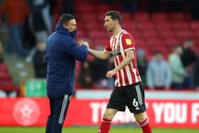 Decision time: Chris Basham, right, is in negotiations over a new deal at Bramall Lane and was back in training this week. (Picture: SportImage)