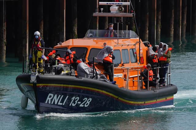 A group of people thought to be migrants are brought in to Dover, Kent, by the RNLI, following a small boat incident in the Channel