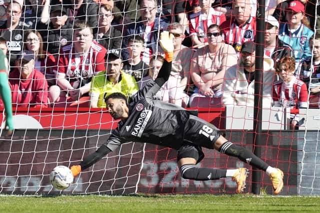 Blades goalkeeper Wes Foderingham denies Matty Wolfe of Barnsley. Picture: Andrew Yates / Sportimage