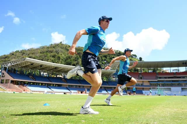 Matthew Fisher (right) warms up during a nets session in Grenada. Picture: Gareth Copley/Getty Images