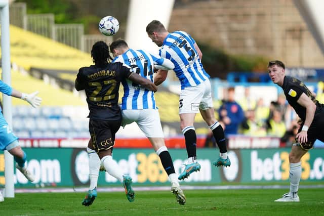 GOALSCORER: Harry Toffolo heads Huddersfield Town back in front a second time