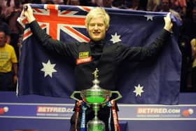 THAT WAS THEN: Neil Robertson with the trophy after winning the World Snooker Championships at the Crucible Theatre back in 2010. Picture: Anna Gowthorpe/PA