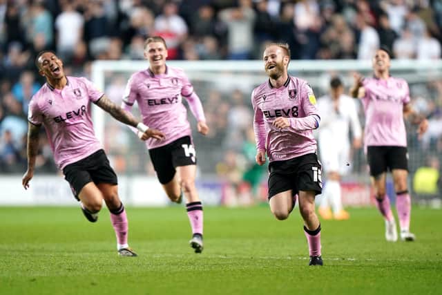 Sheffield Wednesday's Barry Bannan (centre) celebrates scoring his side's third goal of the game against Milton Keynes. Picture: Joe Giddens/PA