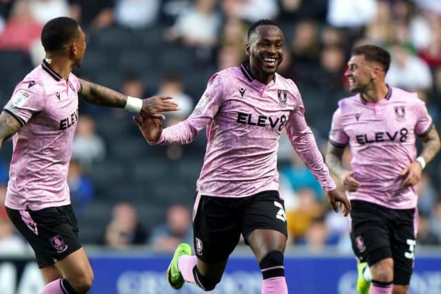 Sheffield Wednesday's Saido Berahino (centre) celebrates scoring their side's first goal of the game against Milton Keynes. Picture: Joe Giddens/PA