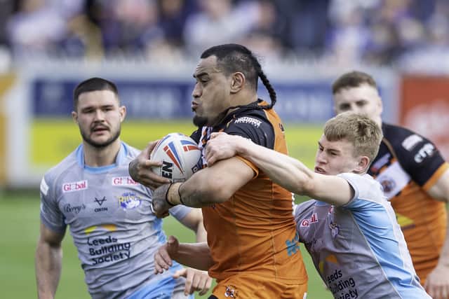 Strong run: Castleford's Mahe Fonua fends off Leeds tacklers. Picture by Allan McKenzie/SWpix.com