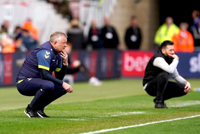 Middlesbrough manager Chris Wilder (left) and Huddersfield Town manager Carlos Corberan ponder their next move at the Riverside Stadium. Picture: Owen Humphreys/PA