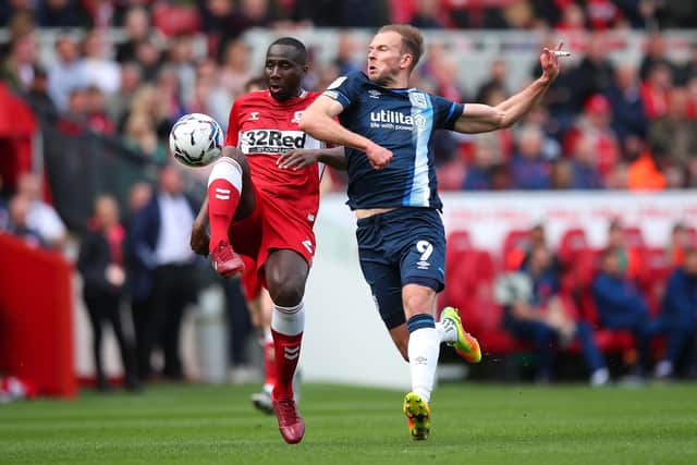 Middlesbrough's Sol Bamba and Huddersfield Town's Jordan Rhodes battle for the ball at the Riverside Picture: Robbie Jay Barratt/Getty Images