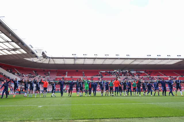Huddersfield Town's players and staff celebrate at full time after beating Middlesbrough at the  Riverside Stadium Picture: Robbie Jay Barratt/Getty Images