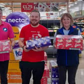 PRITC trustees Andy Bowden and Val French collect Easter eggs from Connor Howland at Sainsbury’s.