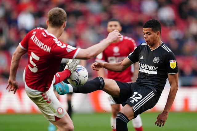 Bristol City's Rob Atkinson (left) and Sheffield United's Tyler Smith battle for the ball at Ashton Gate. Picture: David Davies/PA