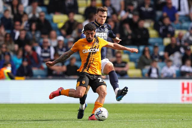 Hull City's Allahyar Sayyadmanesh (left) and Millwall's Jake Cooper battle for the ball at The Den Picture: Kieran Cleeves/PA