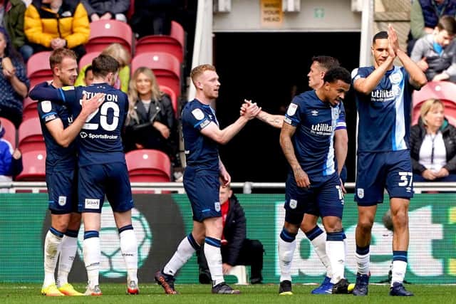 Huddersfield Town's Jordan Rhodes (left) celebrates scoring his side's second goal against Middlesbrough at the Riverside Stadium. Picture: Owen Humphreys/PA