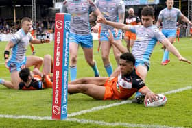 Special day: Leeds Rhinos’ debutant Jack Sinfield can’t prevent Castleford’s Derrell Olpherts from scoring. Picture: Danny Lawson/PA