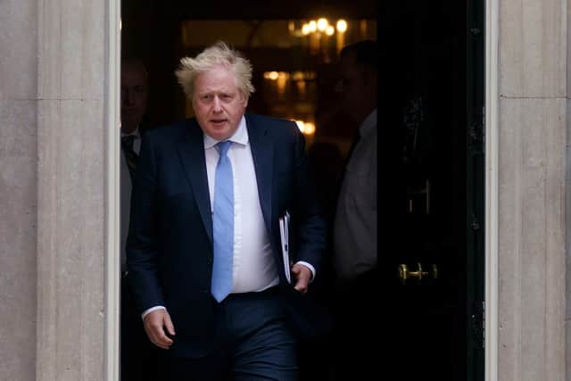 Boris Johnson leaves Number 10 to go to the House of Commons yesterday