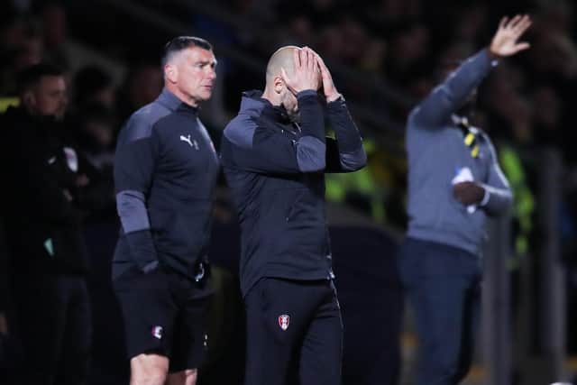 Bad night: United manager Paul Warne, left, can hardly look as his long-time leaders of League One slumped to a fourth defeat in five games. Picture: Isaac Parkin/PA