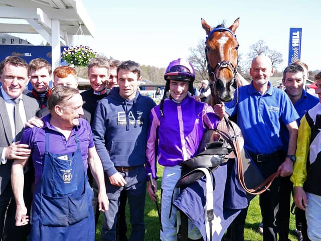 Jockey Brian Hughes (centre) celebrates his 200th season win with horse Dreams of Home and team after winning the Bob Nelson Capercaillie Handicap Chase at Perth Picture: Jane Barlow/PA