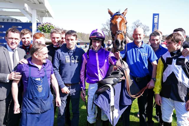 Jockey Brian Hughes (centre) celebrates his 200th season win with horse Dreams of Home and team after winning the Bob Nelson Capercaillie Handicap Chase at Perth. Picture: Jane Barlow/PA