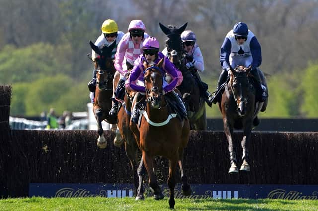 Dreams of Home ridden by jockey Brian Hughes (centre) on their way to winning the Bob Nelson Capercaillie Handicap Chase and his 200th season win at Perth. Picture: Jane Barlow/PA