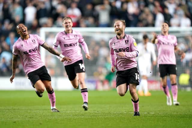 HAPPY DAYS: Sheffield Wednesday's Barry Bannan (centre) celebrates scoring his side's third goal against MK Dons. Picture: Joe Giddens/PA